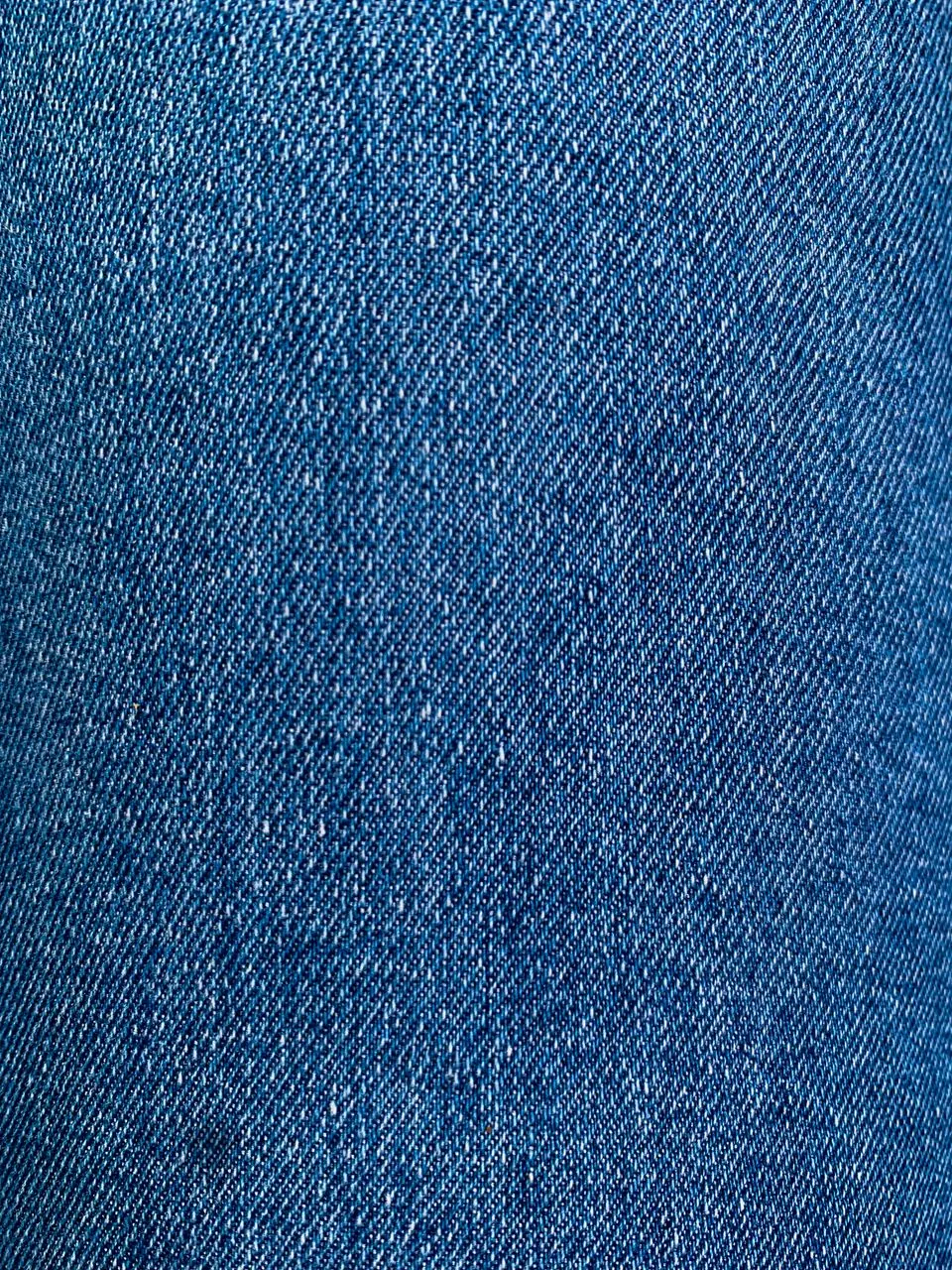 Blue denim fabric showing its diagonal twill weave