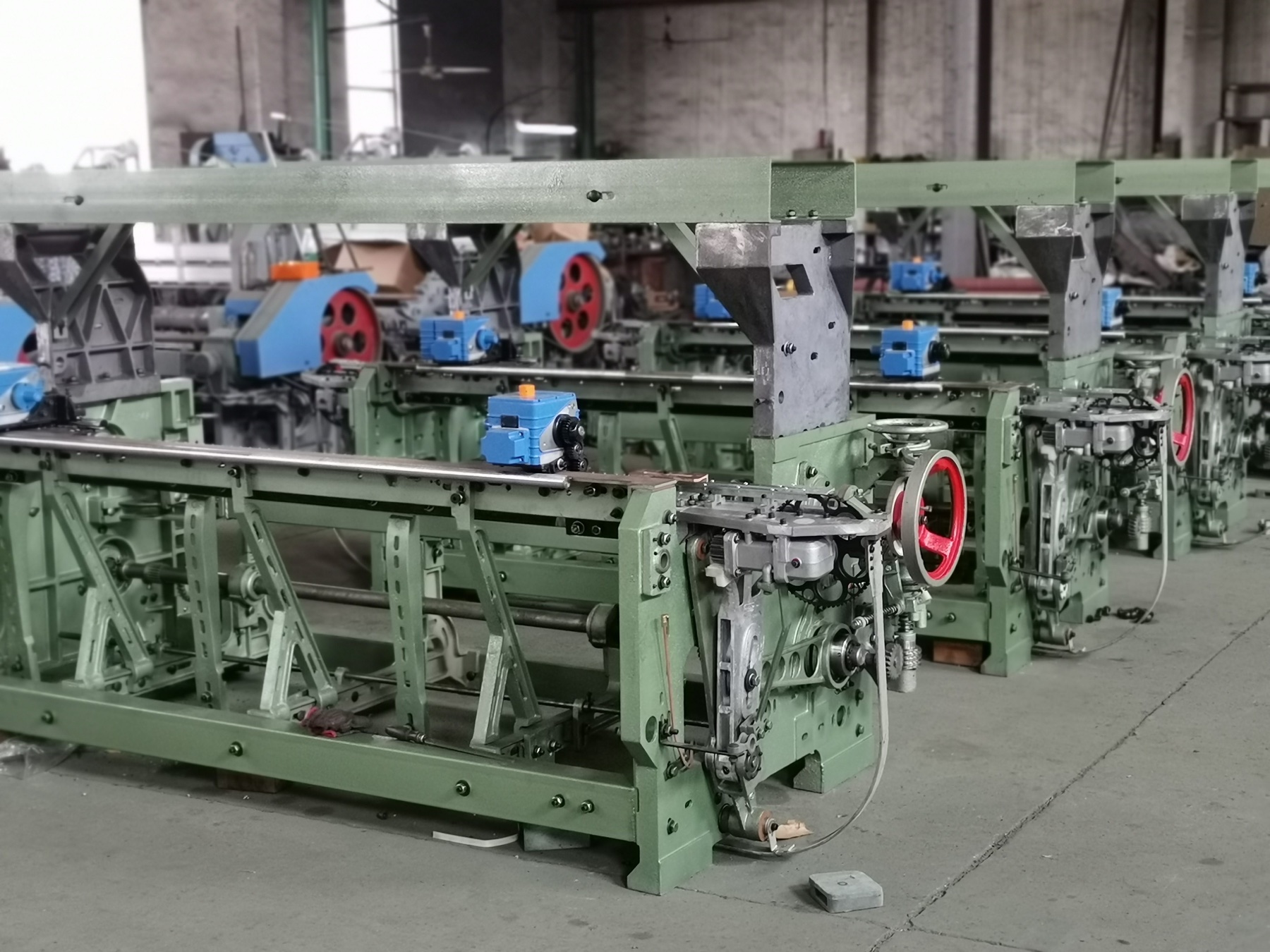 Multiple rapier loom frames and drive mechanisms prepared in a production workshop