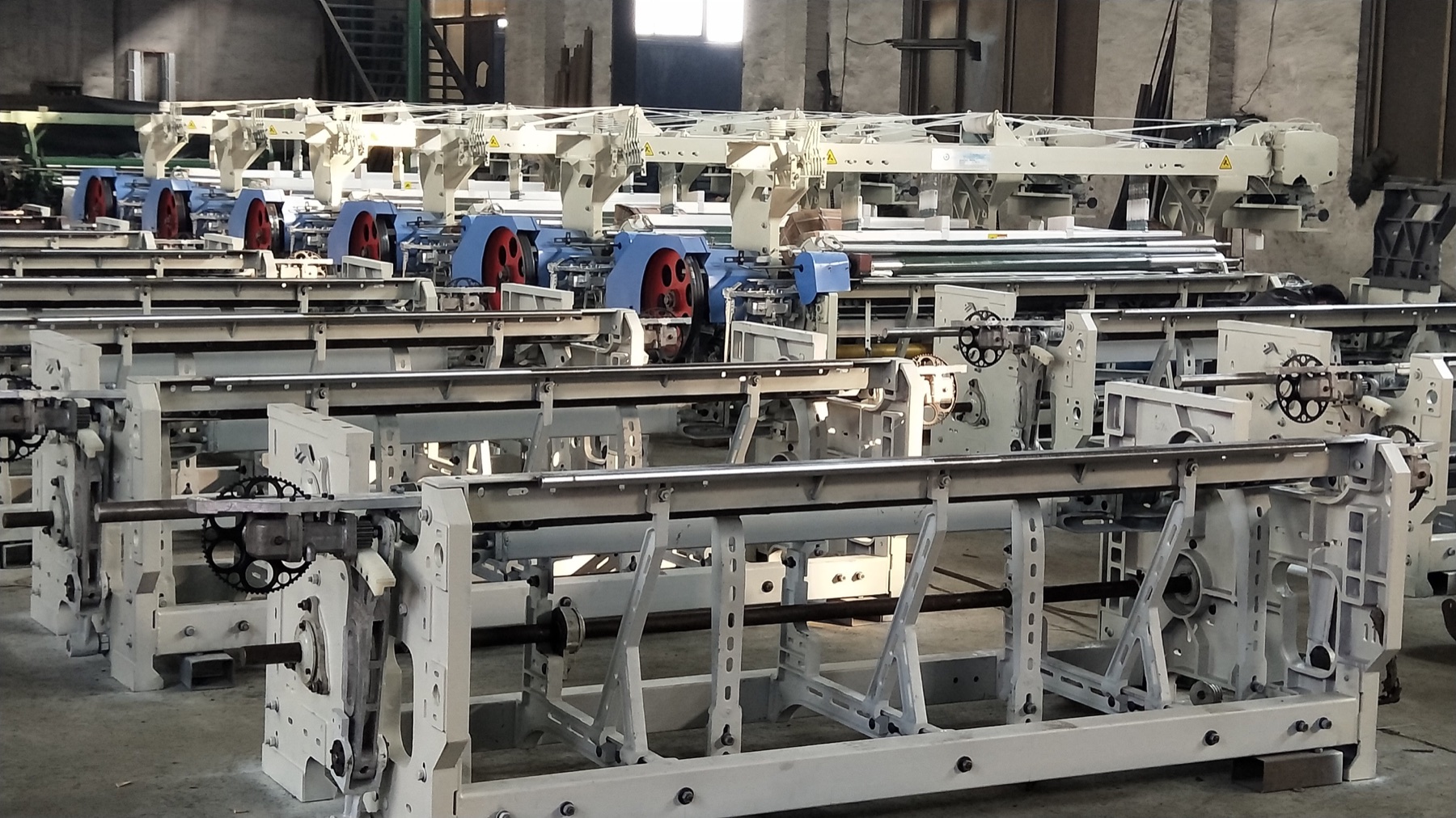 Painted rapier loom frames prepared in batches in the production workshop